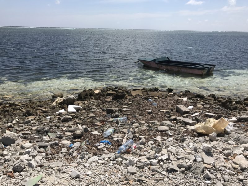 Picking up trash on Maafushi Maldives